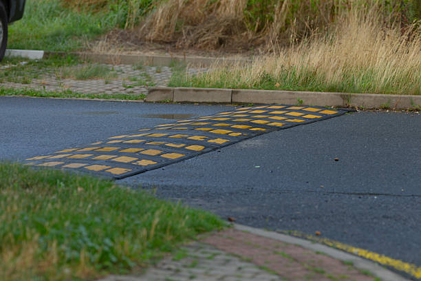 Suburban junction marked by rubber bump and chevron guides for traffic