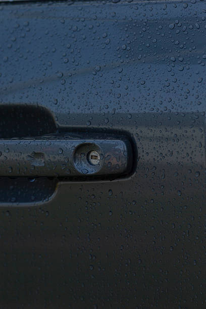 istock Close view capturing moisture and subtle shine on car door handle 2246794759