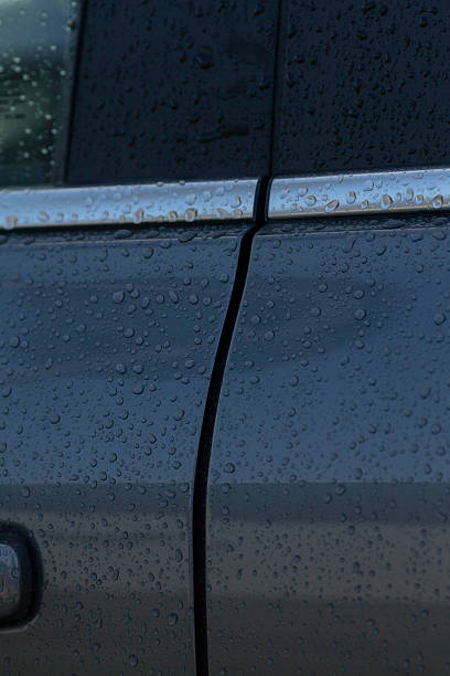 istock Detail technician inspecting hydrophobic coating on vehicle exterior 2246794995