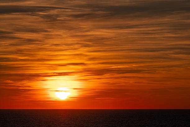 Sunset and dramatic cloudscape over the Mediterranean Sea.
