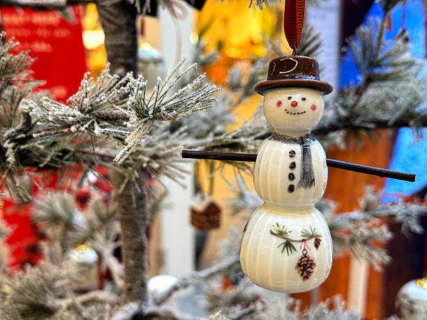 istock Glass snowman hanging on the Christmas tree 2246796237