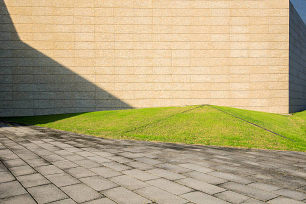 The building's walls, lawns, and pathways