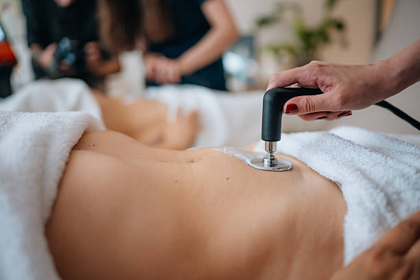 istock Radiofrequency therapy on client's stomach for fat reduction 2246803923