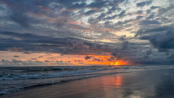 istock dramatic sunset over ocean waves and cloudy sky. peaceful seascape with colorful sky and gentle waves creating a calm natural atmosphere 2246804481