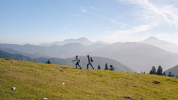 istock Couple hiking through mountain landscape 2246805178