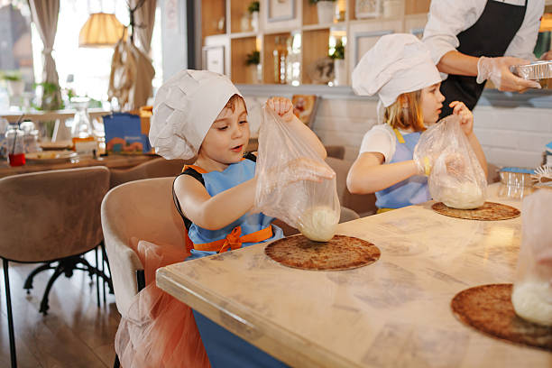 istock Kids enjoy cooking class at local bakery in the afternoon 2246806480
