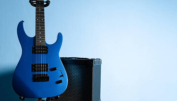 Close up man playing electric guitar