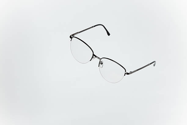 istock Stylish women's eyeglasses with thin metal semi-rim frame on white background. Vsion correction concept. 2246811724