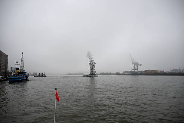 Hamburg, Germany - November 9th 2025 - Fog over the Hamburg Harbor. Ride with the Harbor Ferry along the Elbe River.