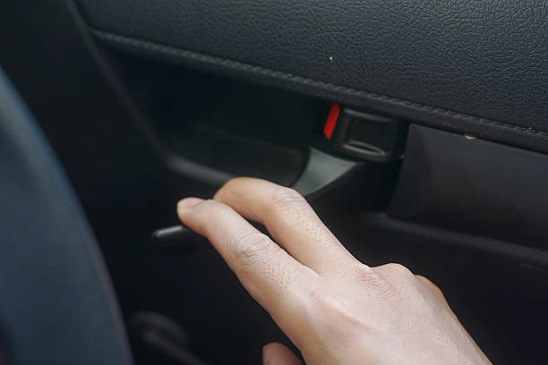 istock Dynamic Close-Up of a Hand Pulling the Interior Handle to Open a Modern Car Door 2246813498
