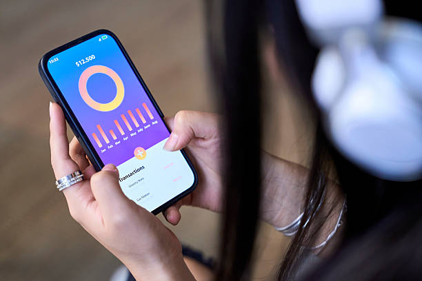 istock Woman managing personal finances using mobile banking app 2246814300