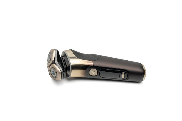 istock Premium electric rotary shaver lying on a white background. 2246814860
