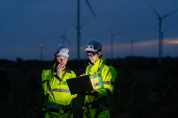 istock Energy engineers on farms during dusk can monitor data and computerized power generation systems to support sustainable clean energy development. 2246816729