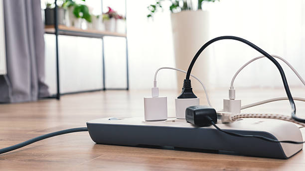 istock White power strip with a blue cord plugged into it 2246820334