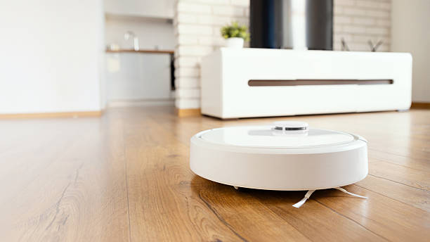 istock Robotic vacuum cleaner cleaning the room 2246820518