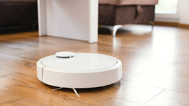 istock Robotic vacuum cleaner cleaning the room 2246820525
