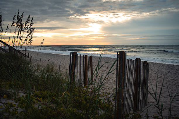 Beautiful cloudscape reflects on the beach of the Atlantic Ocean