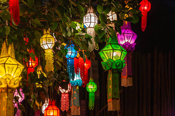 istock Vibrant Lanna lanterns illuminate the night, hanging from tree branches. A colorful display of traditional Thai craftsmanship, perfect for cultural celebrations and festive occasions. 2246822228