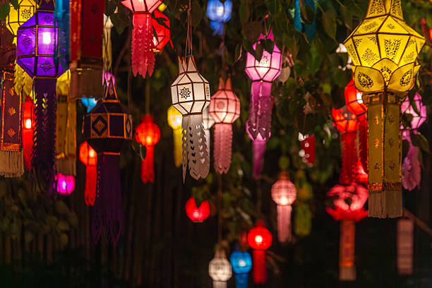 istock Vibrant traditional Lanna lanterns illuminate the night, strung through trees during a cultural festival in Chiang Mai, Thailand. These intricately crafted paper decorations create a captivating and 2246822229