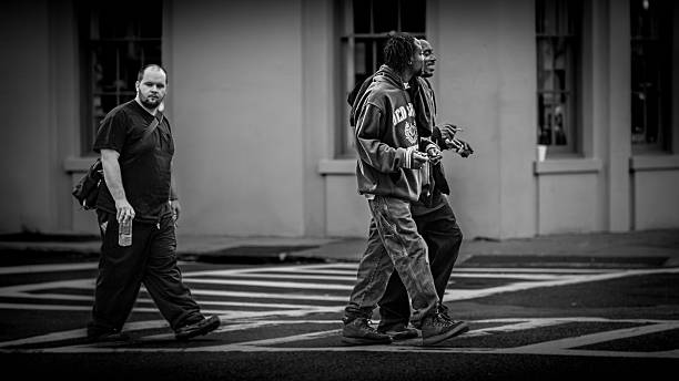 Charleston, South Carolina USA, November 16, 2013, Men walking in crosswalk on street in Charleston, SC