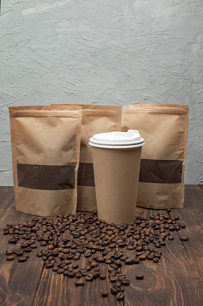 istock Paper cup with coffee beans. Cafe menu design concept. Modern lifestyle. Close-up 2246832766