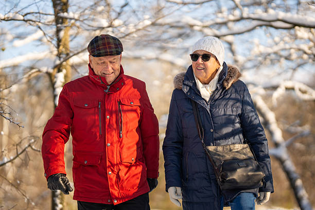 istock smiling senior couple on winter walk 2246841088