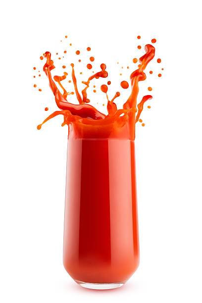 istock Bright red fresh tomato juice in glass with dynamic splashes, flying drops, isolated on white background. Vitamin vegetable smoothie for healthy fitness menu, diet program or wholesome cuisine, detox. 2246842518