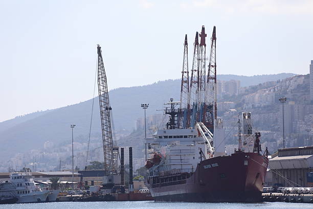 Small ship entering the port at sunrise