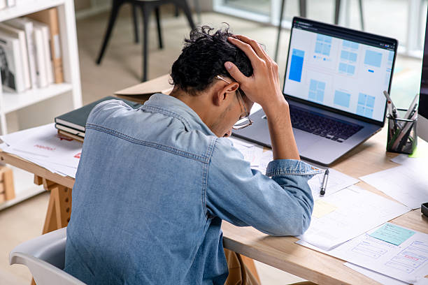 istock Young Businessman looking stressed and tired, Businessman mental burnout while working 2246847662