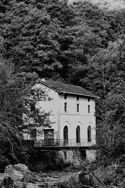 istock Old Hydroelectric House by River in Mountains 2246850817