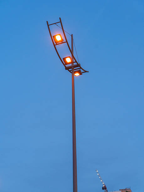 istock Modern Street Lamp Glowing at Dusk 2246851170