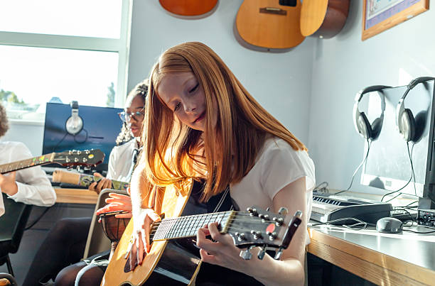 istock A school student playing a musical instrument in a classroom 2246854896