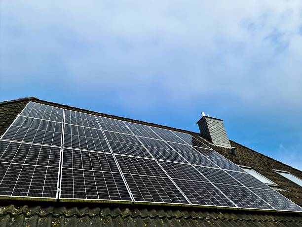 istock Solar panels generating clean energy on house roof 2246855918