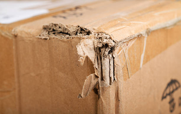 istock Damaged cardboard box reveals wear from shipping and handling process 2246857167