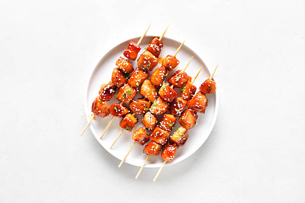 istock Teriyaki chicken skewers on plate 2246859620