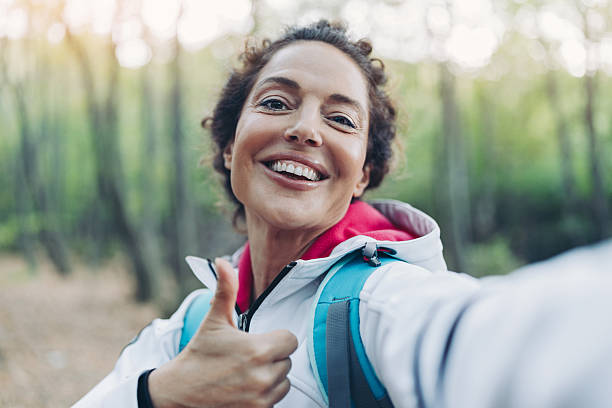 istock Happy hiker filming from the mountain 2246860578