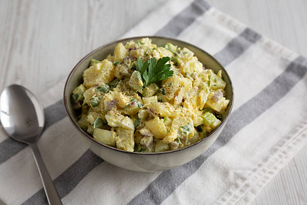 istock Homemade Potato Egg Salad with Pickles in a Bowl, side view. 2246862764