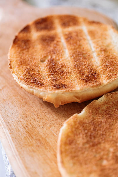 istock Toasted Burger Buns on Wooden Cutting Board 2246863172
