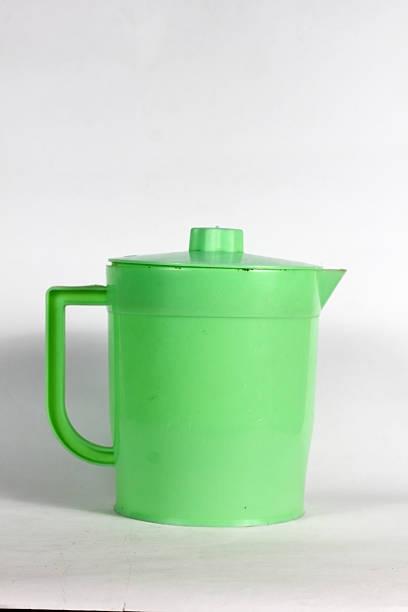 istock green plastic teapot mineral water drink container isolated on white background 2246874467