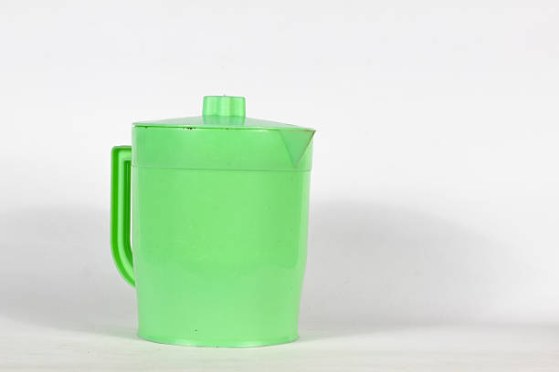 istock green plastic teapot mineral water drink container isolated on white background 2246874483