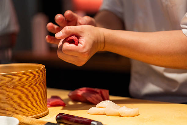 istock Sushi chef preparing fresh seafood with precision in a vibrant kitchen 2246874488