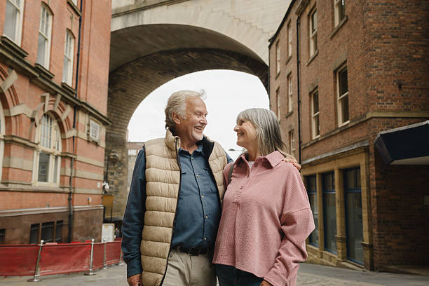 istock Happy senior couple walking and exploring a new city 2246875578