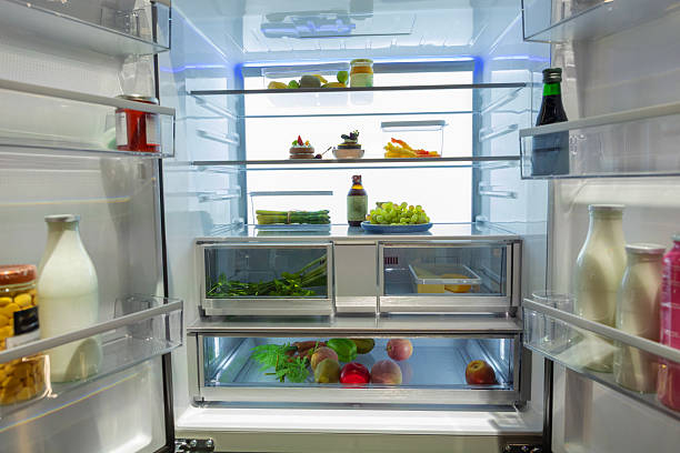 istock Open refrigerator filled with fresh fruits, vegetables, and beverages 2246875600