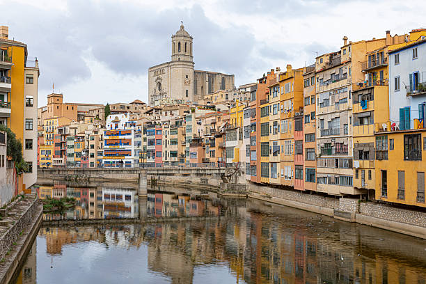 Girona - town in Catalonia, Spain. Onyar River and beautiful mediterranean architecture. Black and white tone.