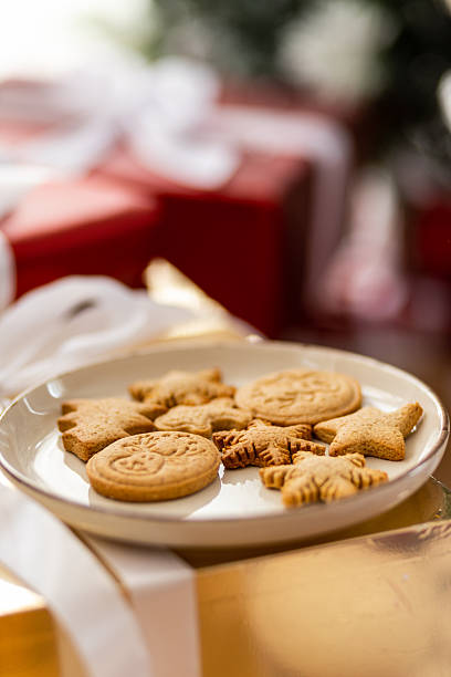 istock Plate of festive cookies on Christmas gift boxes 2246876120