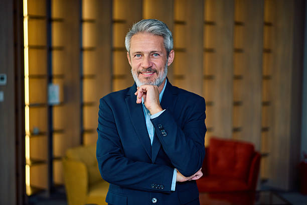 istock Mature businessman smiling with confidence in office 2246882027