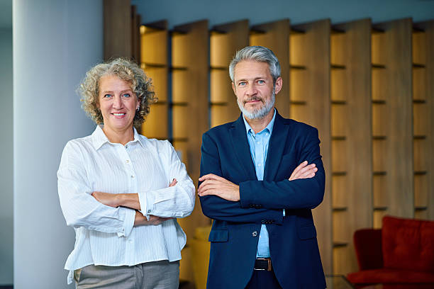 istock Mature business colleagues collaborating in modern office setting 2246882033