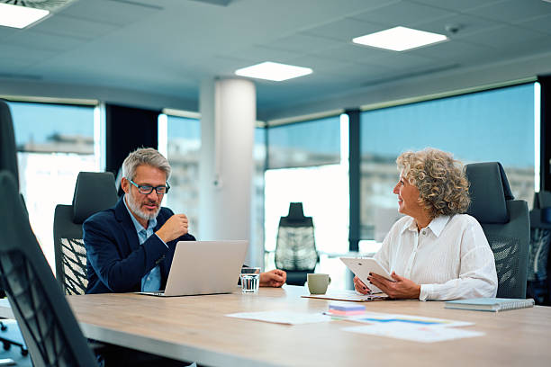 istock Mature business colleagues collaborating during office meeting 2246882602