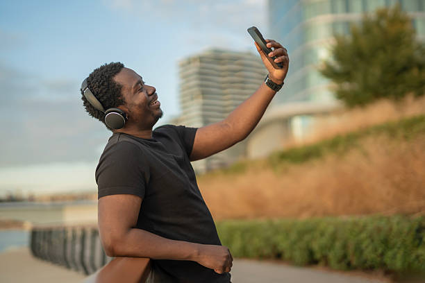 istock Happy black man taking selfie with smartphone 2246884293