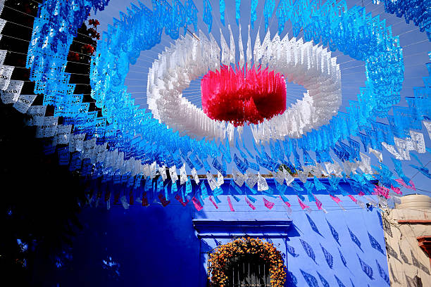 istock Blue Facade with Marigold Arch and Papel Picado Shadows (Oaxaca de Juarez, Mexico) 2246884377